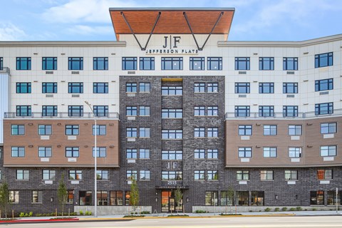 a large hotel building with a sign on top of it